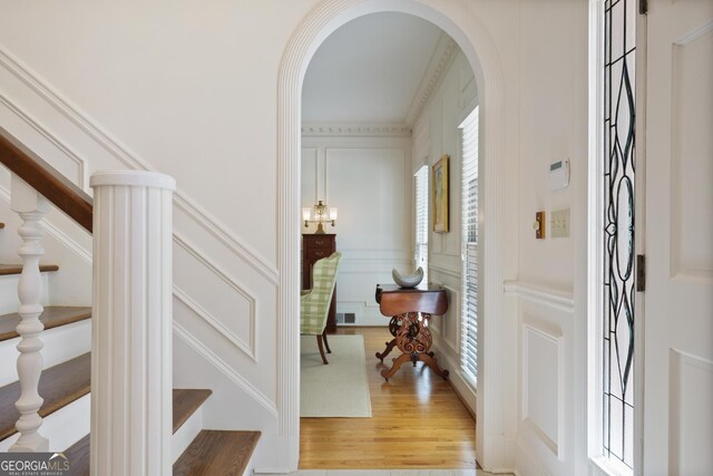 2000 Old Dominion Rd, Atlanta, GA 30350 - entryway featuring arched walkways, a decorative wall, stairway, and light wood-style floors