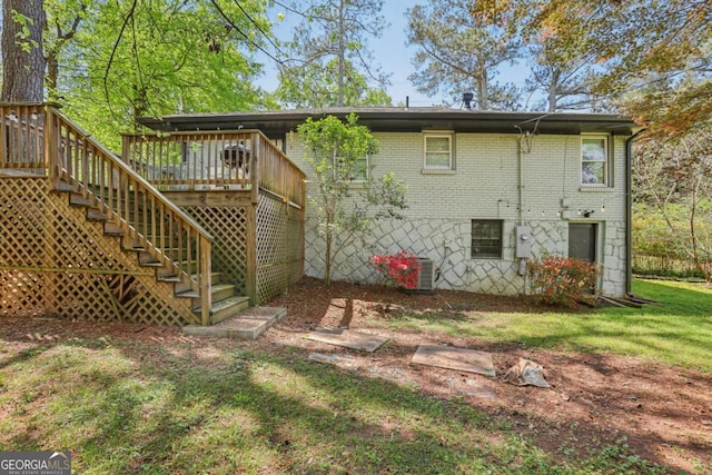 952 Columbia Dr, Decatur, GA 30030 - back of property featuring brick siding, stairway, and a deck