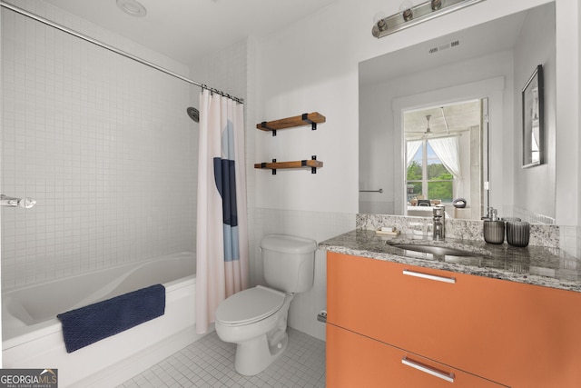 bathroom featuring vanity, tile patterned flooring, visible vents, toilet, and shower / tub combo