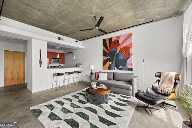 living area with concrete flooring, baseboards, a ceiling fan, and visible vents