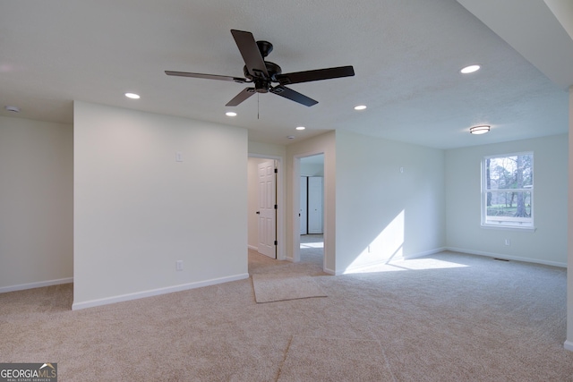 spare room with ceiling fan, baseboards, carpet, and recessed lighting