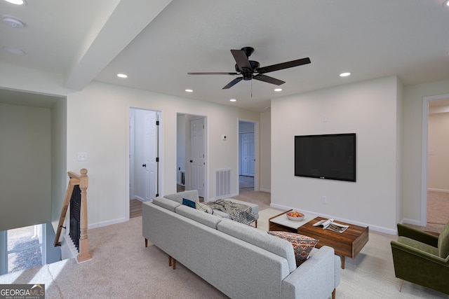 living area with visible vents, baseboards, recessed lighting, and ceiling fan