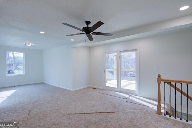 carpeted spare room with recessed lighting, baseboards, and ceiling fan