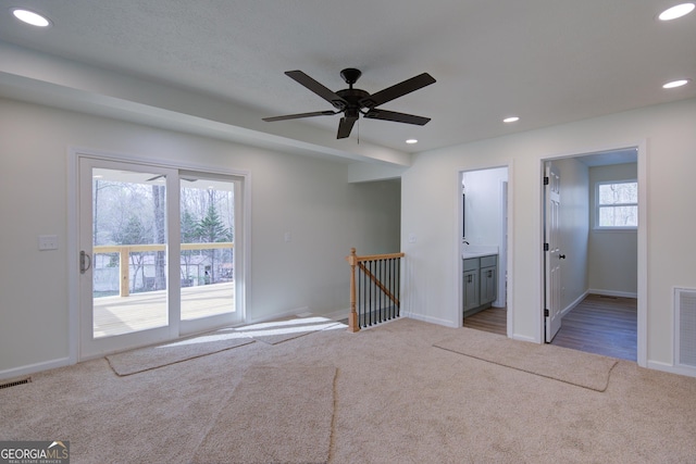 unfurnished bedroom with visible vents, access to exterior, recessed lighting, and carpet flooring