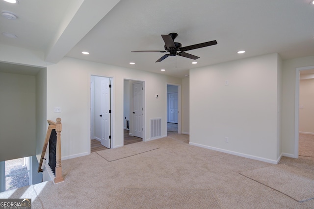 unfurnished living room featuring a ceiling fan, visible vents, carpet floors, recessed lighting, and baseboards