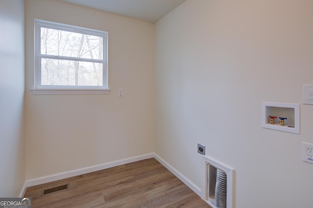 washroom with visible vents, washer hookup, laundry area, wood finished floors, and electric dryer hookup