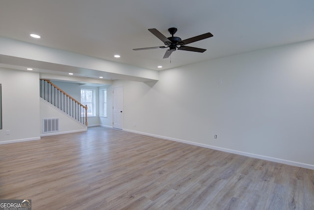 interior space with light wood-type flooring, visible vents, recessed lighting, stairway, and baseboards