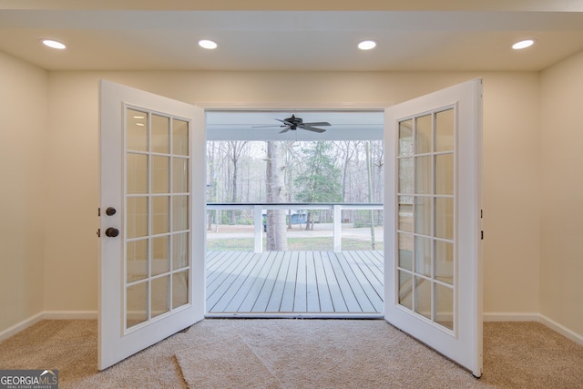 doorway with recessed lighting, carpet, baseboards, and a ceiling fan