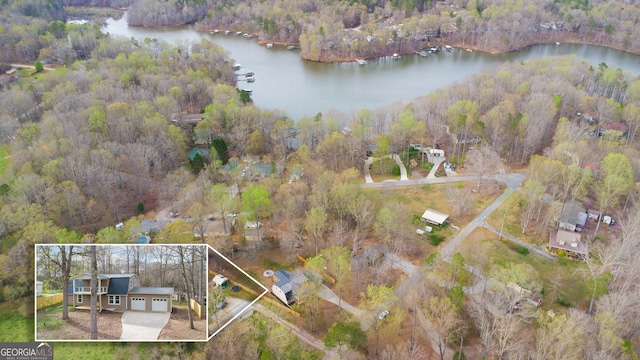 aerial view featuring a water view and a wooded view