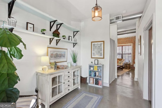 791 Wylie St SE Unit 1111, Atlanta, GA 30316 - hallway with brick wall, concrete flooring, and visible vents