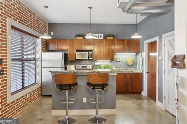 791 Wylie St SE Unit 1111, Atlanta, GA 30316 - kitchen with concrete floors, brick wall, brown cabinets, stainless steel appliances, and a sink