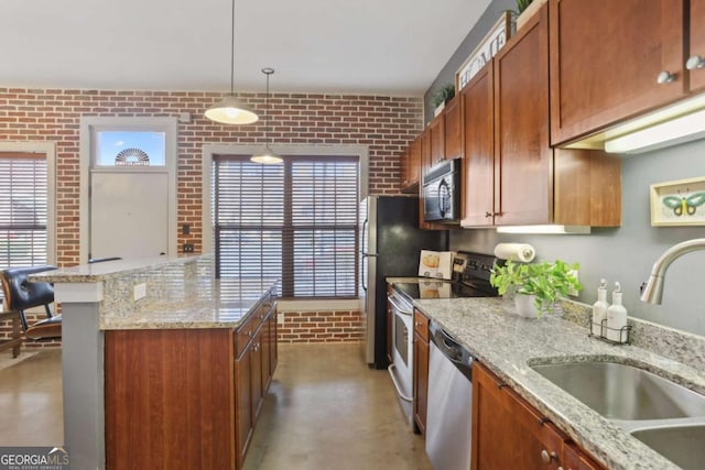 791 Wylie St SE Unit 1111, Atlanta, GA 30316 - kitchen with brick wall, appliances with stainless steel finishes, a sink, and a kitchen island