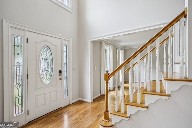 4284 Windy Gap Ct NW, Kennesaw, GA 30144 - entrance foyer with wood finished floors, a towering ceiling, plenty of natural light, and stairway