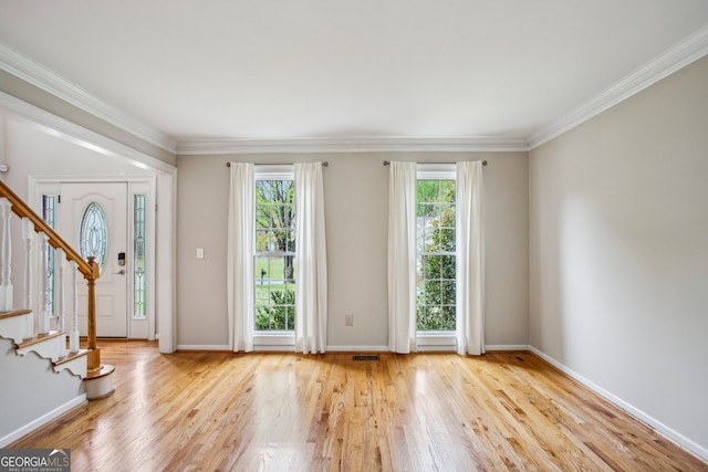 4284 Windy Gap Ct NW, Kennesaw, GA 30144 - entryway with crown molding, stairway, and wood finished floors