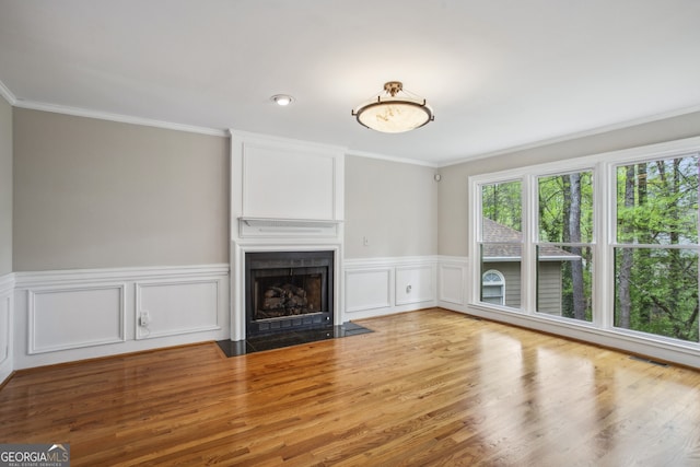 4284 Windy Gap Ct NW, Kennesaw, GA 30144 - unfurnished living room featuring wood finished floors, a fireplace, and ornamental molding