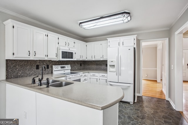 4284 Windy Gap Ct NW, Kennesaw, GA 30144 - kitchen featuring a sink, ornamental molding, white appliances, and a peninsula