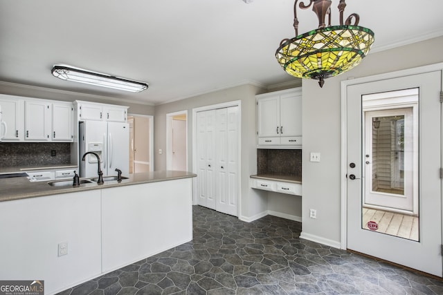 4284 Windy Gap Ct NW, Kennesaw, GA 30144 - kitchen featuring white refrigerator with ice dispenser, white cabinetry, a sink, and ornamental molding