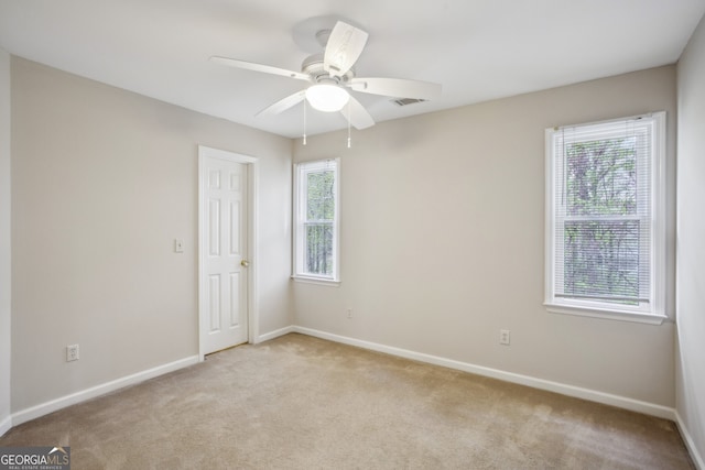 4284 Windy Gap Ct NW, Kennesaw, GA 30144 - carpeted spare room featuring ceiling fan, baseboards, visible vents, and a wealth of natural light