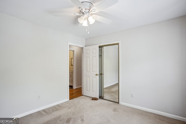 4284 Windy Gap Ct NW, Kennesaw, GA 30144 - unfurnished bedroom featuring a closet, baseboards, carpet flooring, and ceiling fan