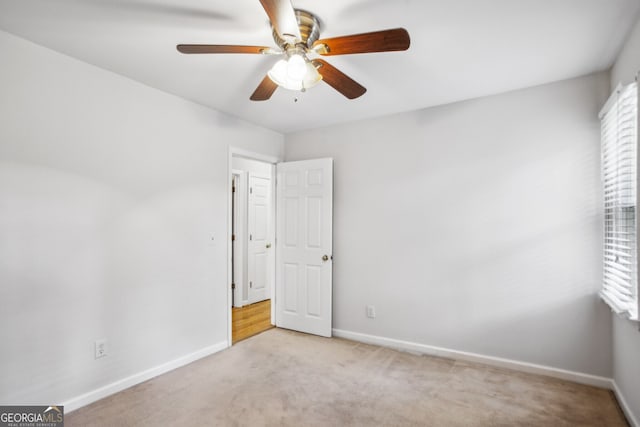 4284 Windy Gap Ct NW, Kennesaw, GA 30144 - unfurnished bedroom featuring carpet flooring, multiple windows, and ceiling fan