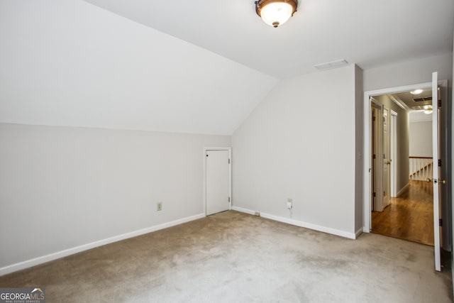 4284 Windy Gap Ct NW, Kennesaw, GA 30144 - additional living space featuring visible vents, vaulted ceiling, carpet floors, attic access, and baseboards