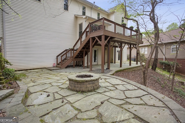 4284 Windy Gap Ct NW, Kennesaw, GA 30144 - view of patio with a wooden deck, a fire pit, and stairs