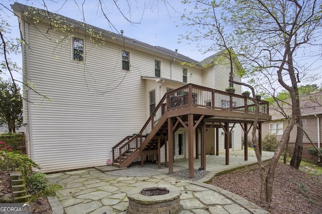 4284 Windy Gap Ct NW, Kennesaw, GA 30144 - rear view of house with a deck, a patio, a fire pit, and stairway