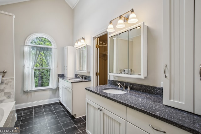 4284 Windy Gap Ct NW, Kennesaw, GA 30144 - bathroom with a sink, two vanities, tile patterned flooring, and a bathtub
