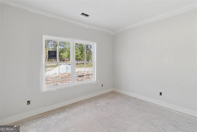 unfurnished room featuring visible vents and baseboards