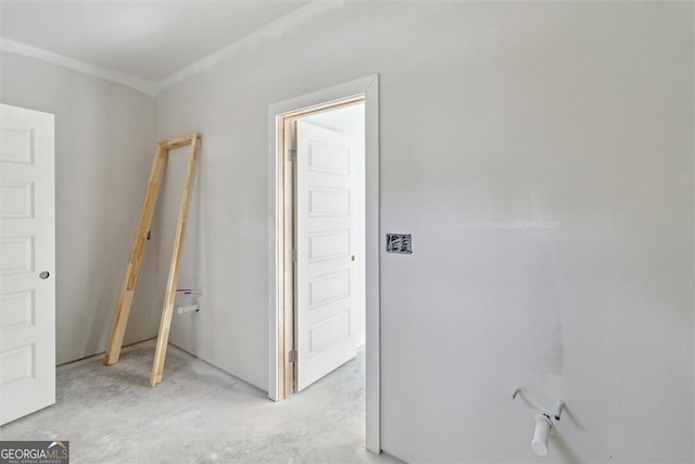 unfurnished bedroom featuring unfinished concrete flooring