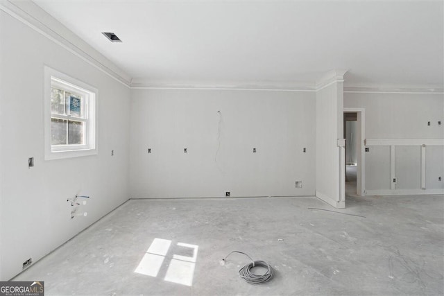 unfurnished room featuring ornamental molding