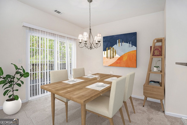 dining room featuring baseboards, visible vents, carpet flooring, and a chandelier