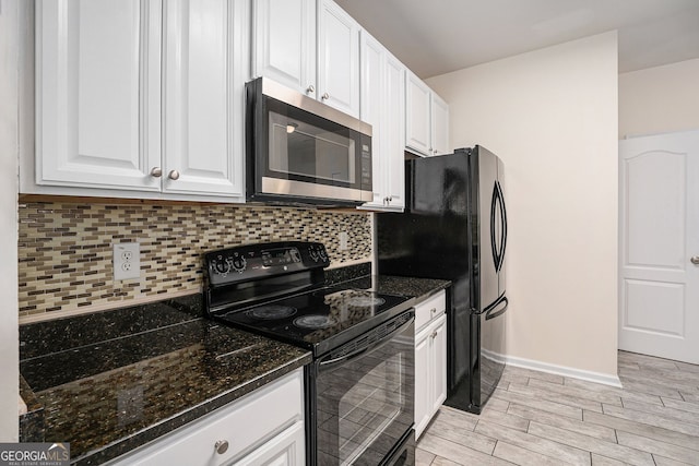 kitchen featuring wood tiled floor, decorative backsplash, black appliances, and white cabinetry