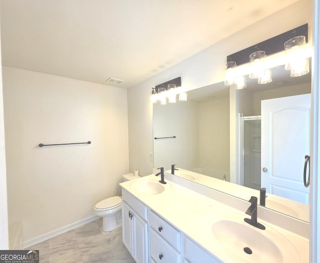 bathroom featuring visible vents, a sink, marble finish floor, and a shower stall