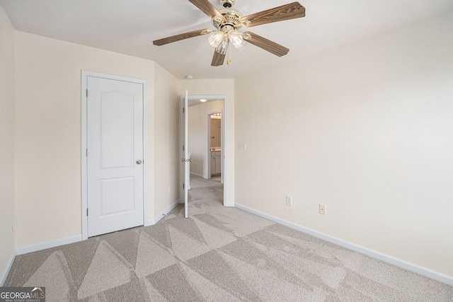 unfurnished bedroom with a ceiling fan, baseboards, and light colored carpet