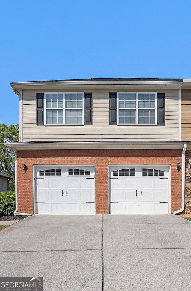 exterior space featuring concrete driveway