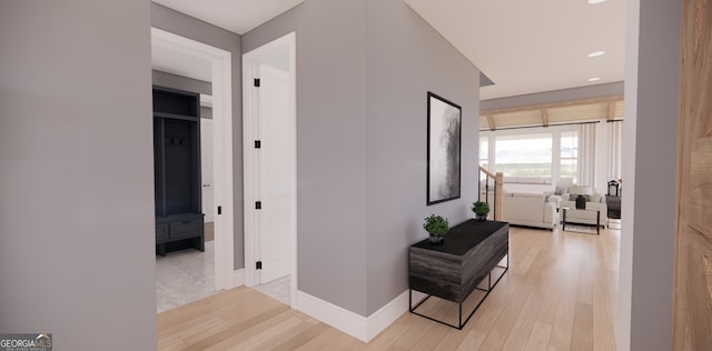 corridor featuring baseboards, recessed lighting, and light wood-type flooring