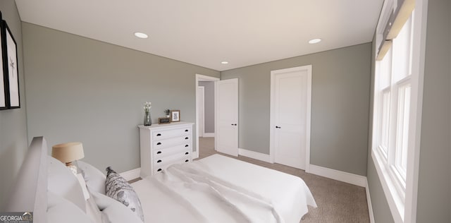 bedroom with recessed lighting, baseboards, and light colored carpet