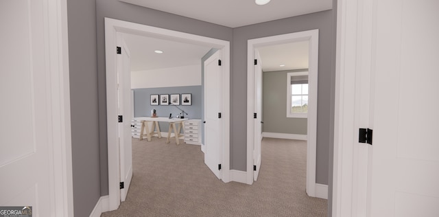 corridor with recessed lighting, baseboards, and light colored carpet