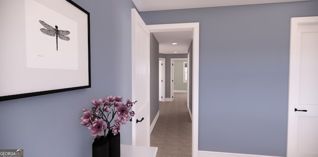 hallway featuring recessed lighting, carpet, and baseboards