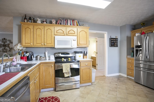 45 Hunters Ridge Ct, Covington, GA 30014 - kitchen featuring light countertops, a textured ceiling, a sink, and stainless steel appliances