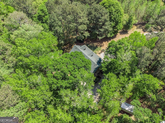 drone / aerial view featuring a forest view