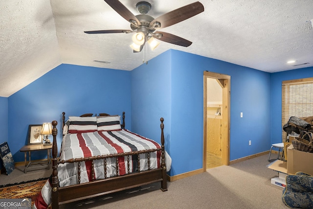 bedroom with carpet floors, a textured ceiling, and baseboards