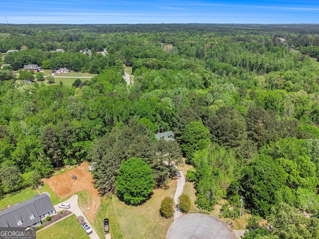 bird's eye view featuring a forest view