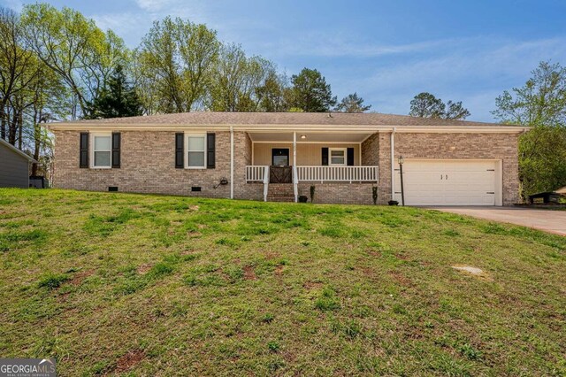 182 Hickory Dr, Ringgold, GA 30736 - ranch-style home featuring a front yard, a porch, crawl space, a garage, and concrete driveway
