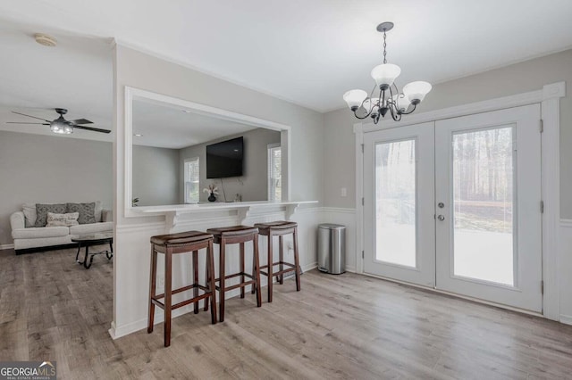 182 Hickory Dr, Ringgold, GA 30736 - dining area featuring french doors, wood finished floors, and ceiling fan with notable chandelier
