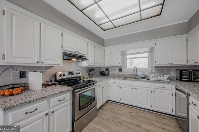 182 Hickory Dr, Ringgold, GA 30736 - kitchen featuring a sink, under cabinet range hood, light wood finished floors, white cabinetry, and stainless steel appliances