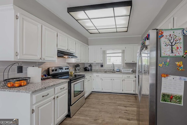 182 Hickory Dr, Ringgold, GA 30736 - kitchen featuring tasteful backsplash, white cabinets, under cabinet range hood, stainless steel appliances, and a sink