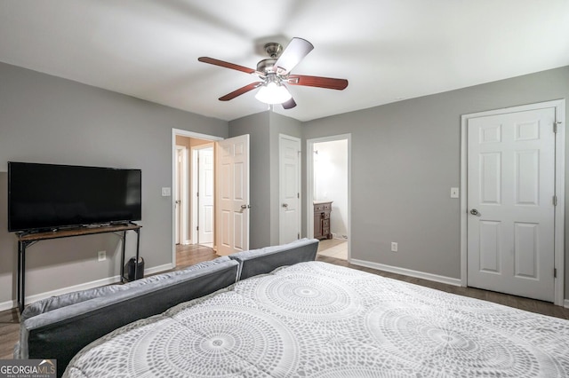 182 Hickory Dr, Ringgold, GA 30736 - bedroom with baseboards, a ceiling fan, connected bathroom, and wood finished floors