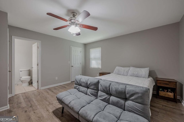 182 Hickory Dr, Ringgold, GA 30736 - bedroom with ensuite bathroom, baseboards, a ceiling fan, and wood finished floors